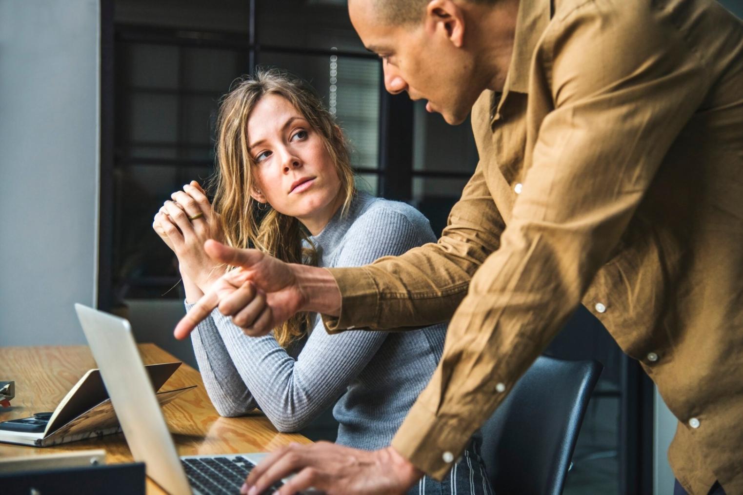 Person reviewing financial strategies and budget planning materials